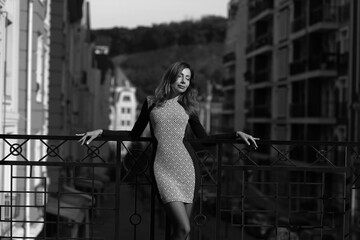 Urban portrait of beautiful woman in the street in black and white