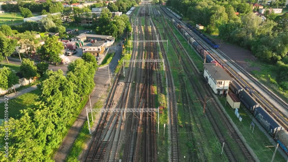 Poster the view from the drone on the railroad tracks against the background of the setting sun. concept of