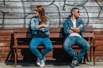 angry couple sitting on the bench