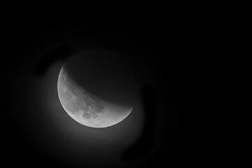 Lunar eclipse in a foggy night night.