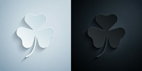 Paper cut Clover trefoil leaf icon isolated on grey and black background. Happy Saint Patricks day. National Irish holiday. Paper art style. Vector
