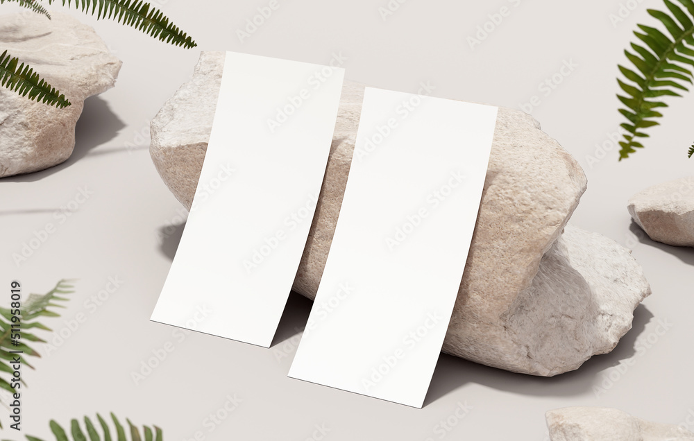 Poster two flyer mockup blank paper resting on a rock for design presentation and stationery concept. white