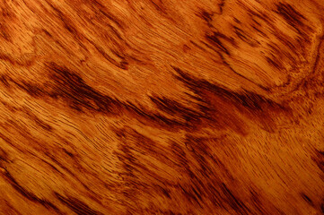 Guitar deck made of bubinga tree. Pretty surface of guitar deck - macro. Background picture.