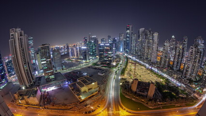 Fototapeta na wymiar Panorama of Bay Avenue with modern towers residential development in Business Bay aerial night timelapse, Dubai