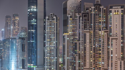 Bay Avenue with modern towers residential development in Business Bay aerial night timelapse, Dubai