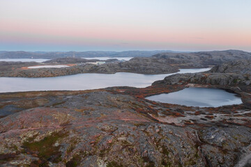 Lake in Teriberka in autumn. Colorful tundra landscape on the Kola Peninsula in autumn