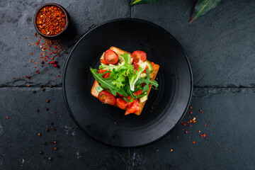 Open sandwiches with salted salmon, guacamole avocado and microgreens. Seafood. Healthy food. Top view.