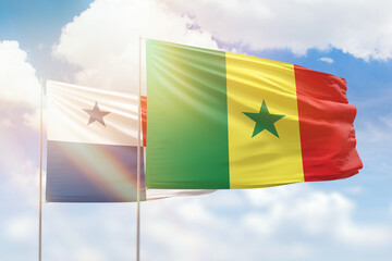 Sunny blue sky and flags of senegal and panama
