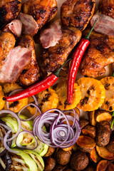 Steakhouse menu. Closeup of smoked meat, poultry assortment, baked Bonduelle corn.