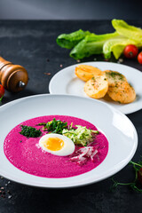 Vegan food, summer cold Beetroot soup with fresh herbs copy space top view