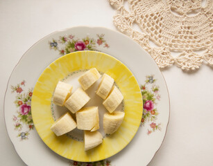 Banana bunch and peeled pieces  photo Tropical fruits, banana snack or vegetarian nutrition.  Top view