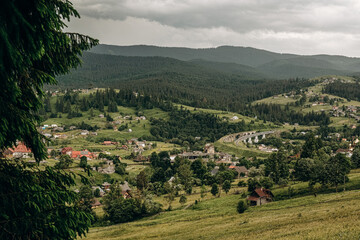 Naklejka premium The rain starts in the mountains. Dark rain clouds covered the sky in Goah in summer.