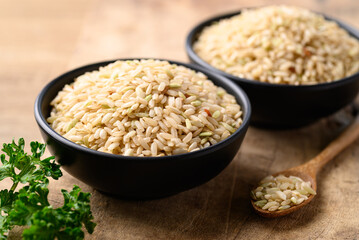 Organic Thai brown rice grain in bowl, Healthy food ingredients