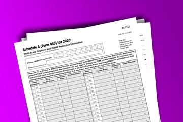 Form 940 (Schedule A) documentation published IRS USA 11.23.2020. American tax document on colored