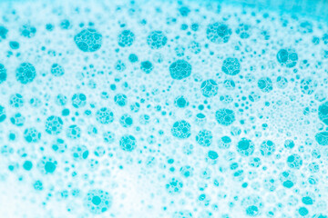  water with white foam bubbles.Cleanliness and hygiene background. Foam Water Soap Suds.Texture Foam Close-up. blue soap bubbles background.Laundry and cleaning background.foam bubbles.