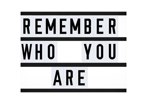 Inspirational Remember Who You Are quote on vintage retro board. Concept. flat lay	