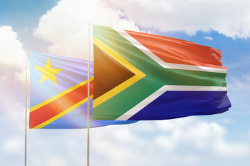 Sunny blue sky and flags of south africa and dr congo
