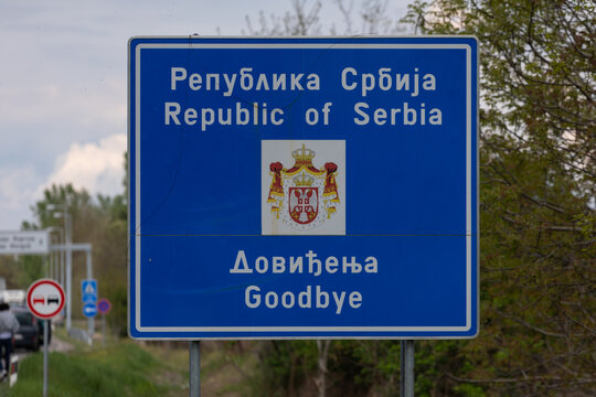 Republic of Serbia, Goodbay. Road sign with message and the National emblem on border between Serbia and Hungary