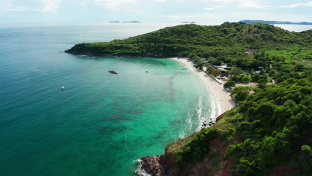 Aerial view of Koh Larn beach, Pattaya with blue turquoise seawater on the famous island of Koh Larn, Pattaya, Thailand, tourism outdoor. Andaman sea in island in summer, travel trip. Drone b roll.