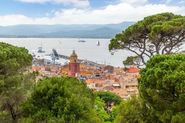 Fotobehang The harbor, marina and old town of Saint-Tropez, France along the French Riviera seen from the ancient citadel or castle on the hill. © Kirk Fisher