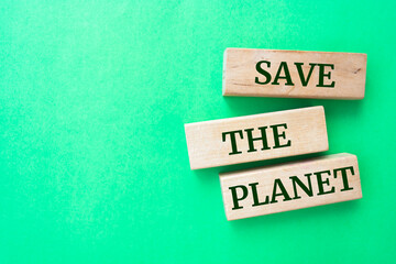Wooden blocks with words 'Save The Planet'.