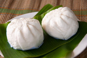 Malaysian Traditional steam buns on banana leaf. Asian food concept