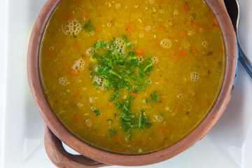 Lentil vegetable soup in a bowl.