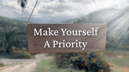 Inspirational quote text on wooden banner - Make yourself a priority. Inspirational concept