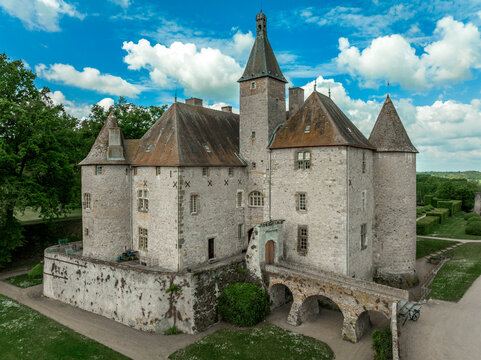 Aerial view of Beauvoir in Allier a medieval wonder that overlooks the valley of Besbre, with beautifully manicured French garden in idyllic setting with towers, bridge, moat, palace