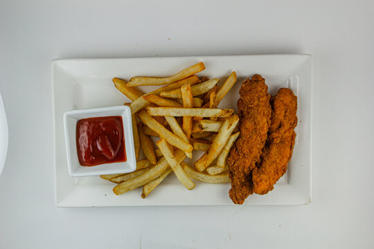 Chicken tenders and fries. 