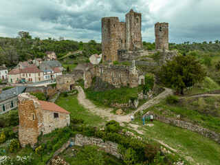 Aerial view of the ruins of Herisson fortress of the Dukes of Bourbon dominate the medieval city of H&eacute;risson and Aumance Valley with towers standing tall in the inner castle in central France