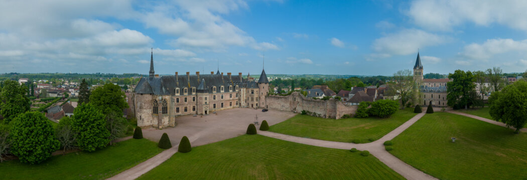 Aerial panoramic view of Lapalisse castle in the Allier department of the Auvergne-Rh&ocirc;ne-Alpes in France with Renaissance wing from rose colored brick, Gothic chapel
