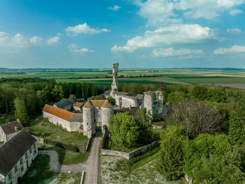 Aerial view of Montepilloy castle near Senlis France, remains of fortified castle with tall keep, enclosure with a polygonal ditch, an entrance gatehouse, curtain wall with battlements