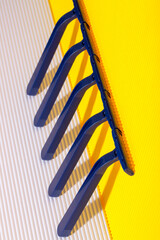 Abstract still life with razors on a colored background
