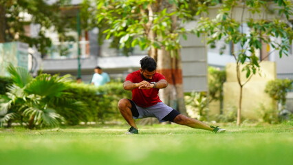 Naklejka premium Young Asian healthy man workout at park exercise fit doing yoga fitness concept stock images