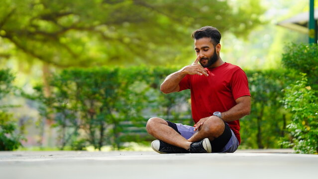 international yoga day image boy sitting in lotus position at park