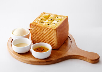 Delicious Chinese dessert, passion jam ice cream condensed milk toast .on white background