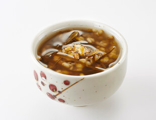 Delicious Chinese dessert, seaweed mung bean syrup .on white background