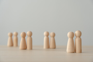 Goup of people in wooden figures faceless. Social, network, relationship among people in community.