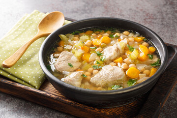 Italian Day of the Dead Soup Minestra dei morti closeup in the plate on the wooden board. Horizontal