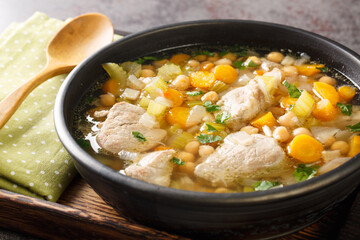 Italian Cuisine Minestra Dei Morti Soup of the Dead closeup in the plate on the wooden board. Horizontal