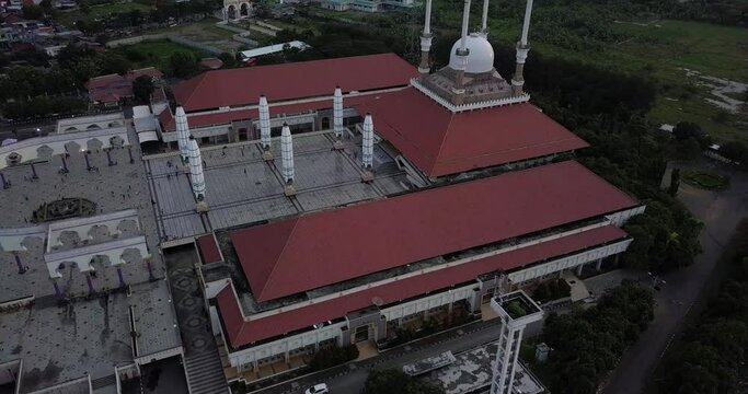 Aerial view of the great Mosque of Central Java (MAJT) in suset time. The mosque have some towers and have some large umbrella that is closed