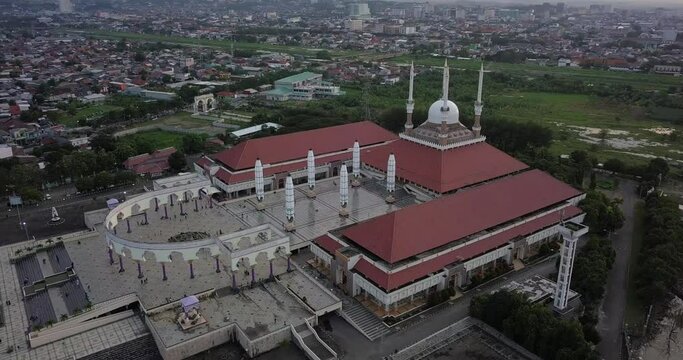 Aerial view of the great Mosque of Central Java (MAJT) in suset time. Th sun is orange and the weather is cloudy. Point of interest drone shot