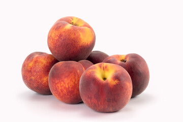 Peaches isolated on bright background. Close up view.