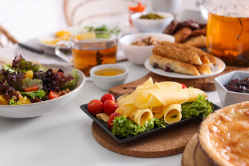 Many different dishes served on buffet table for brunch