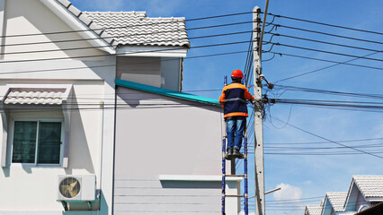 the technician of internet service provider is checking fiber optic cables after install on...