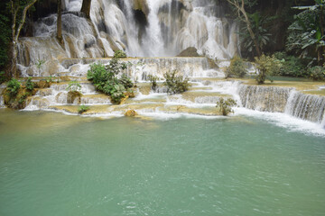 Naklejka premium Tat Kuang Si Waterfalls is one of the waterfalls. Located about 32 kilometers from Luang Prabang, Laos, it is known as the most beautiful waterfall of Luang Prabang. Laos PDR 