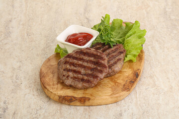 Grilled beef burger cutlet with sauce
