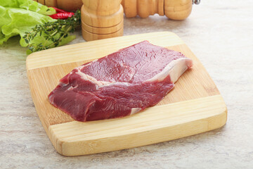 Raw rib-eye beef steak black angus