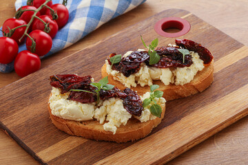 Bruschetta with soft cheese and tomato
